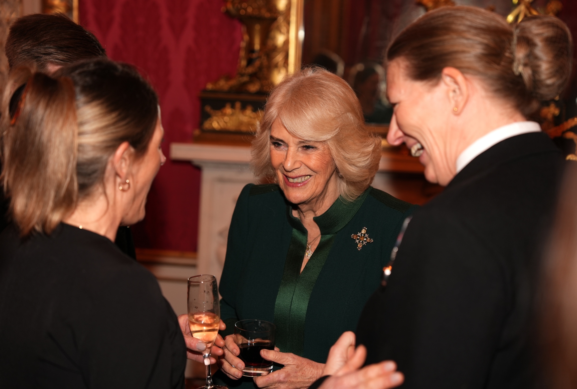 Queen Camilla, Buckingham Palace, King Charles III, military families, green dress, reception