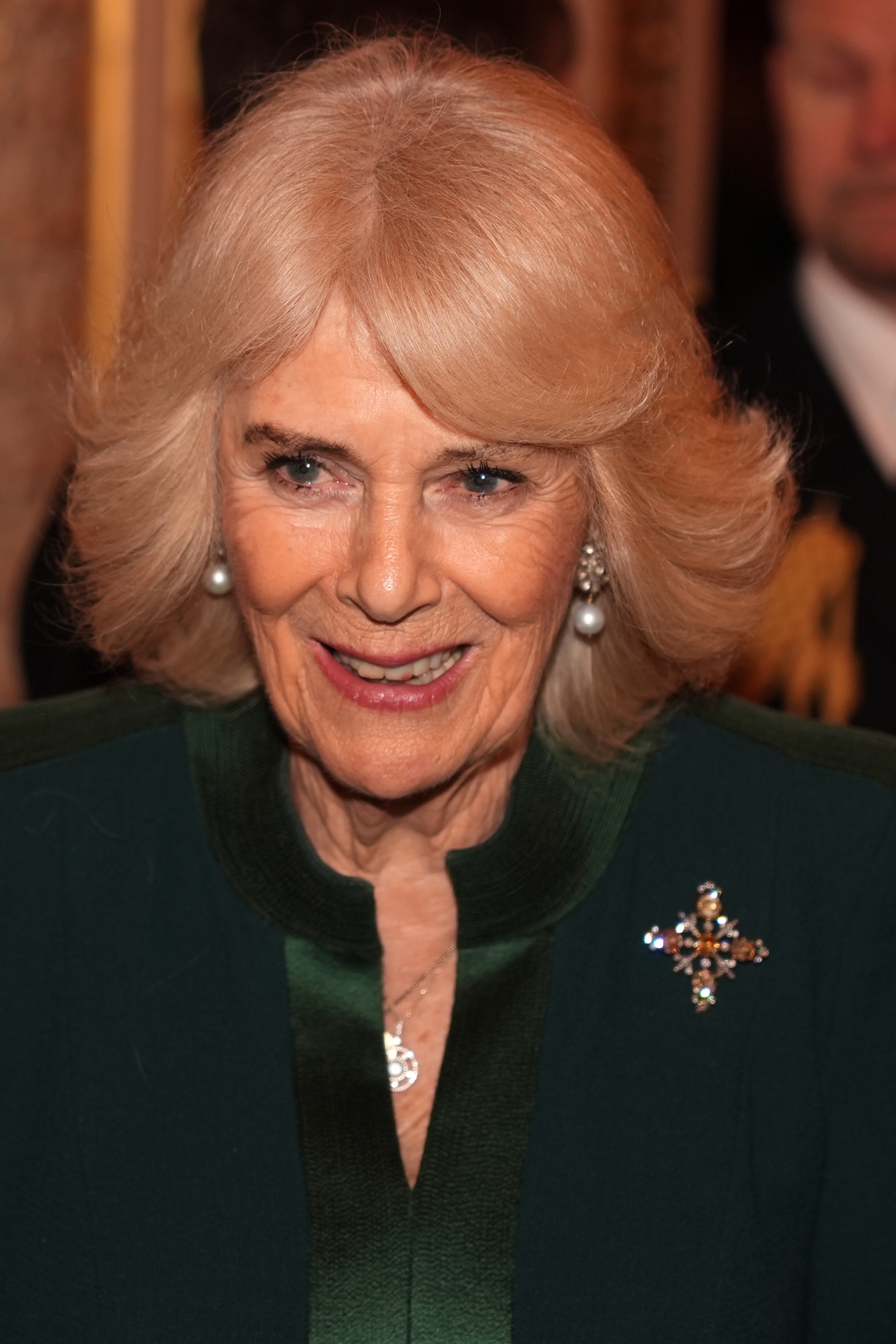 Queen Camilla, Buckingham Palace, King Charles III, military families, green dress, reception